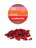 mountain cranberries, wild, 3oz, live live & organic. Small pile of Mountain Cranberries with the label above.