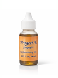 Bottle of Progest-E Complex replenishing oil by Kenogen, on a white background