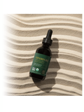 Bottle of Vitamin B12 on a striped fabric background