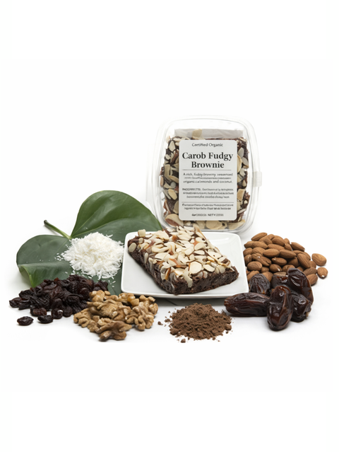 Carob fudgy brownie with ingredients on a white background