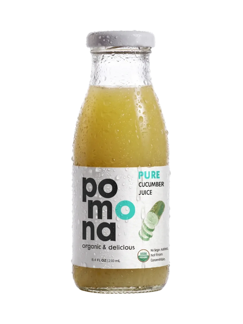 A bottle of Pomona organic cucumber juice with a gray cap, shown against a plain white background. The glass bottle is covered in condensation droplets, and the label features green cucumber imagery.