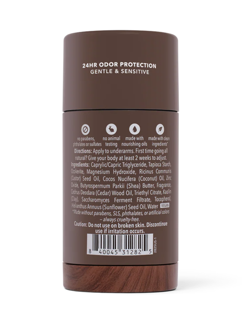 A dark brown cylindrical container of body odor protection, showing the back label with text and a barcode on a white background.