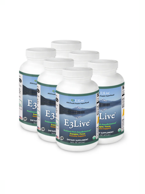 Multiple bottles of E3Live dietary supplement on a white background