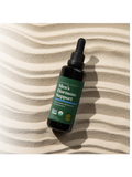 Bottle of Men's Hormone Support on a striped fabric background