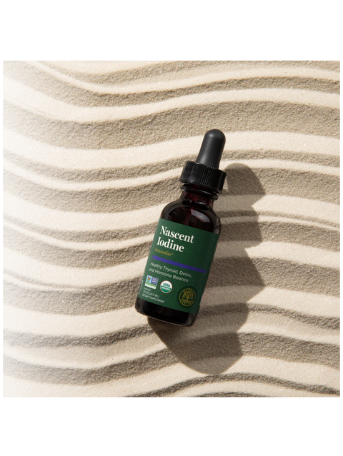 Bottle of Nascent Iodine on a textured beige surface
