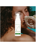 Organic Night Crème, 1oz, by Dr. Alkaitis with a woman and flower in the background