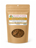 A stand-up kraft paper pouch of Higher Power Mindful Raw Foods Onion Crackers, featuring a clear window showing the brown and beige cracker pieces inside, on a white background.