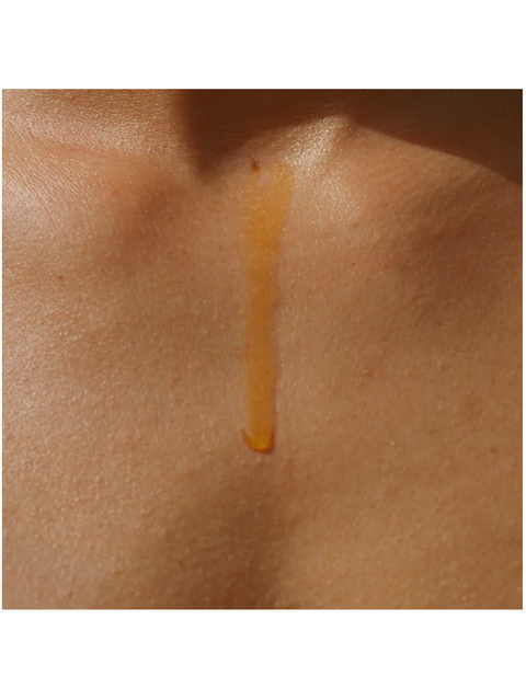 Close-up of a Organic Ageless Facial Elixir, by Dr Alkaitis, droplet on skin