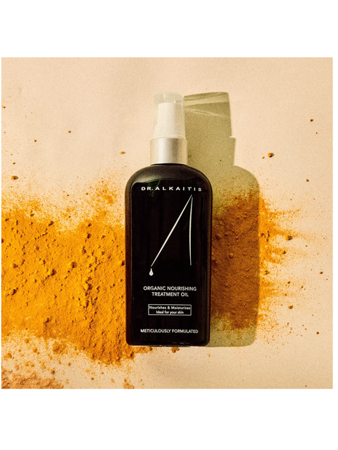 Organic Nourishing Treatment Oil, by Dr Alkaitis on a textured beige background