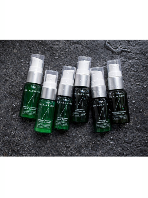 Set of Organic Skin Care Travel Kit, Dr Alkaitis, on a textured surface