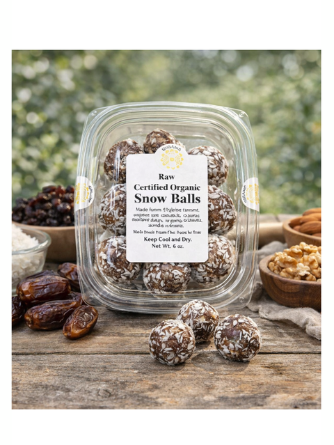 Packaged raw certified organic snow balls on a wooden surface with ingredients in the background.