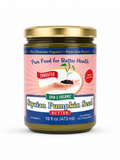 A jar of Blue Mountain Organics Sprouted Styrian Pumpkin Seed Butter, featuring a pink and blue label with a gold lid, set against a plain white background.