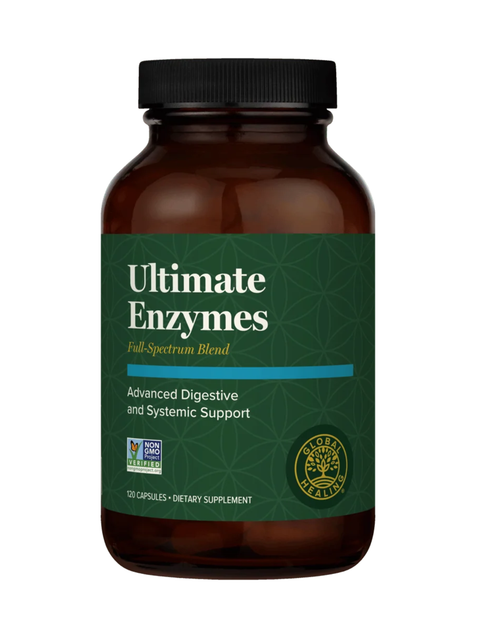 A bottle of Global Healing's Ultimate Enzymes dietary supplement, featuring an amber brown bottle with a black cap and a dark green label.