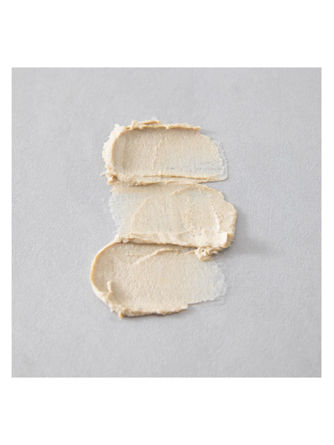 Three swatches of Vanilla & Sage Body Scrub, Pacha Soap on a gray background