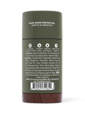 The back of a dark olive green cylindrical bottle with white text reading '24HR ODOR PROTECTION GENTLE & SENSITIVE' and a barcode label, shown on a white background.