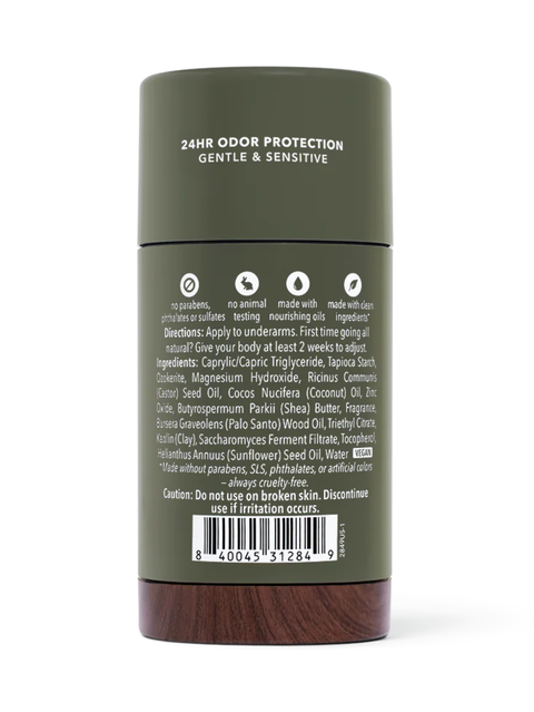 The back of a dark olive green cylindrical bottle with white text reading '24HR ODOR PROTECTION GENTLE & SENSITIVE' and a barcode label, shown on a white background.