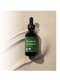 Vitamin D3 dropper bottle on a beige background