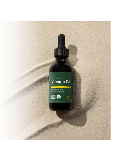 Vitamin D3 dropper bottle on a beige background