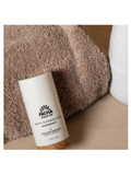 Pacha Soap Co deodorant stick on a towel with a neutral background