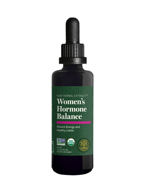A dark amber glass dropper bottle of Women's Hormone Balance raw herbal extract, featuring a green label with white text and a pink accent line, on a plain white background.